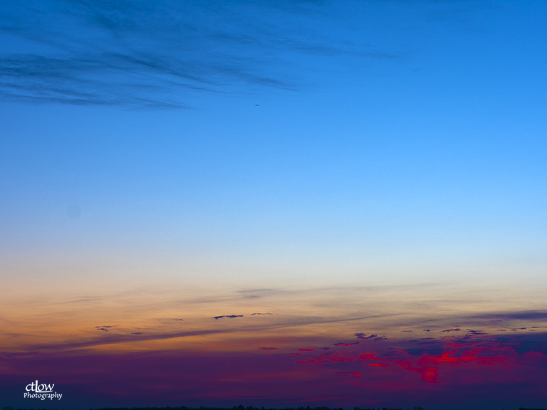 dawn sky flaming red clouds